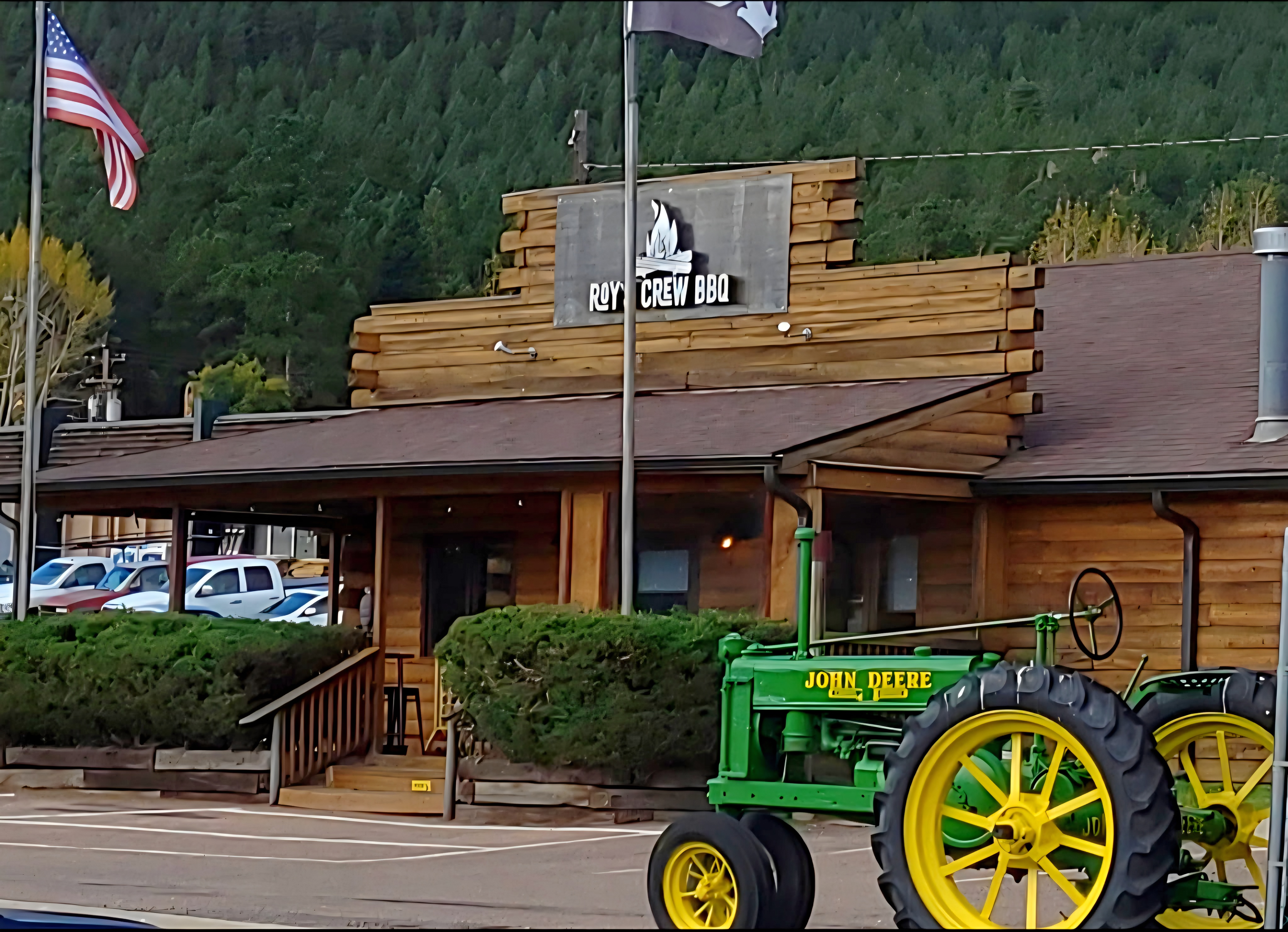 Roy's Crew BBQ with a tractor displayed in front